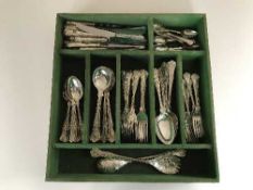 A stained pine drawer containing EPNS Cambridge cutlery