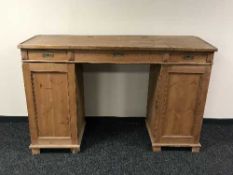An antique pine pedestal clerk's desk