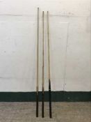 Three snooker cues