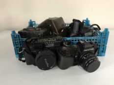 A box of assorted cameras - Microcord Rollei camera in leather case, Pentax, Yashika,