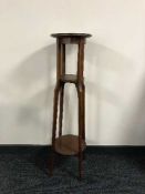A Victorian inlaid mahogany plant stand