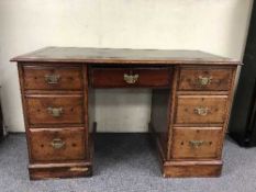 A late Victorian pine twin pedestal desk
