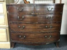 A Victorian inlaid mahogany bow-fronted five drawer chest
