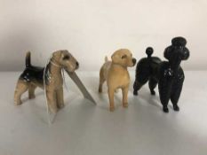 Three small Beswick figures - Labrador poodle and terrier
