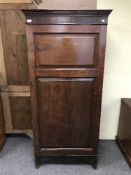 A mahogany sentry door wardrobe