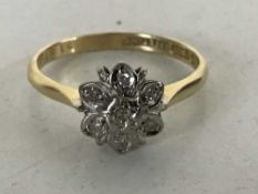 An 18ct gold diamond cluster ring
