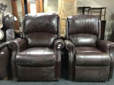 A pair of brown leather electric reclining armchairs