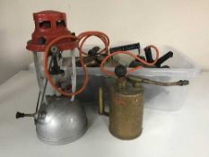 A box of vintage blow torches, wood working planes,