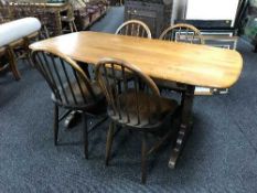 An Ercol refectory table and four chairs