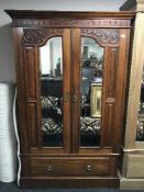 An Edwardian mahogany double door wardrobe