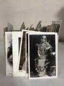 A box of antiquarian and later postcards