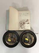 An early 20th century album of sketches and poems and two framed prattware pot lids
