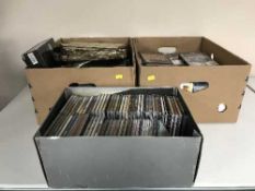 Three boxes of CDs and DVDs,