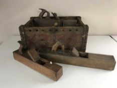 A wooden crate of vintage hand tools,