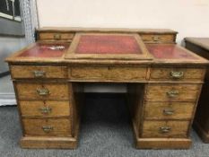A late Victorian oak clerk's desk with writing slope,