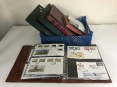 A box and one album of first day covers and stamps