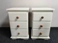 A pair of painted pine bedside chests