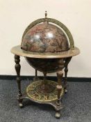 A globe drinks trolley containing cocktail-making accessories