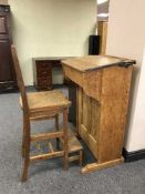 An early 20th century oak clerk's desk with chair