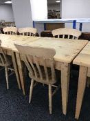 A pine square kitchen table and two chairs