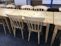 A pine kitchen table and four chairs