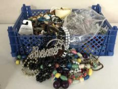 A large quantity of costume jewelery including bead necklaces, some silver, wristwatches, brooches,
