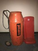 A Jetair gas space heater and two fire extinguisher stands