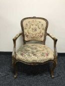 A carved walnut framed armchair