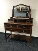 A Victorian inlaid mahogany dressing table