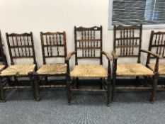 A set of nine antique rush seated kitchen chairs