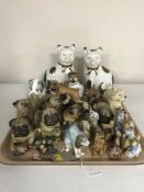 A tray of china figures, dogs, Wade whimsies,
