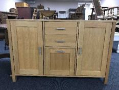 A pair of contemporary oak sideboards