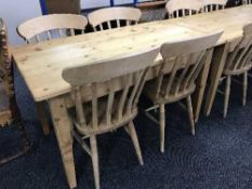 A pine kitchen table and four chairs
