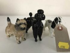 Three small Beswick figures - poodle,