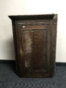 A Victorian oak hanging corner cupboard