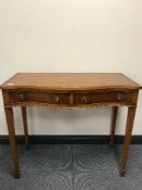 An inlaid yew wood cutlery table
