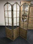 An antique gilt wood three way room divider