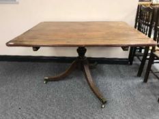 A Victorian mahogany tilt top dining table
