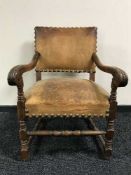 An antique carved oak armchair