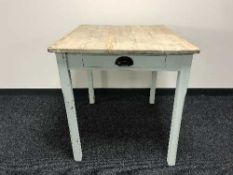 A pine kitchen table fitted a drawer