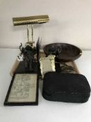 A tray of banker's desk lamp, wooden fruit bowl, elephant book ends, Art Deco brass photo frame,