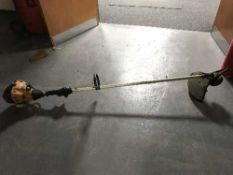 A JCB petrol strimmer