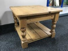 A square pine coffee table