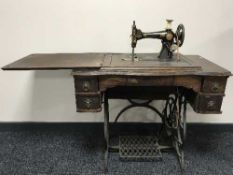 An oak treadle sewing machine
