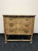 A continental oak shaped chest drawers