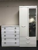 A white compactum wardrobe and four drawer chest