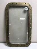 A brass framed ship's window