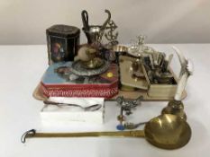 A tray of commemorative tins, cutlery, plated ware,
