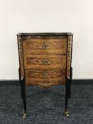 An inlaid three drawer chest with ormolu mounts