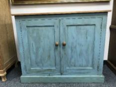 A low reclaimed pine painted cupboard